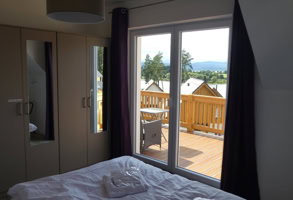 Hotel bedroom with view on Lipno Lake